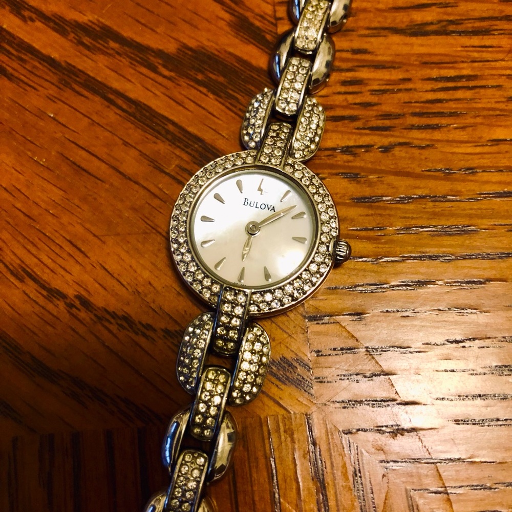 Bulova watch with mother of pearl face, Swavorski crystals stainless steel